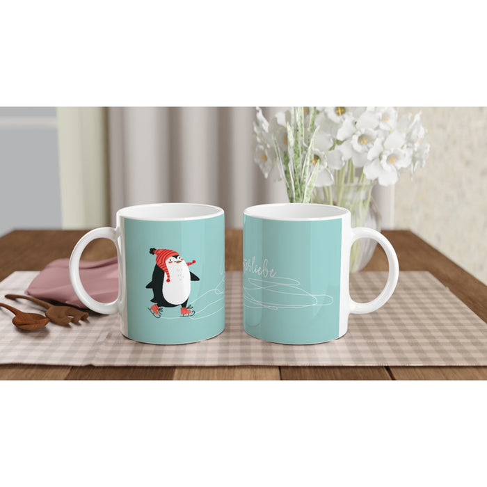 Tasse Winterliebe - süßer Pinguin mit Wollmütze läuft Schlittschuh