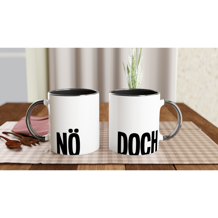 Der Spruch NÖ und DOCH in schwarz auf einer Tasse